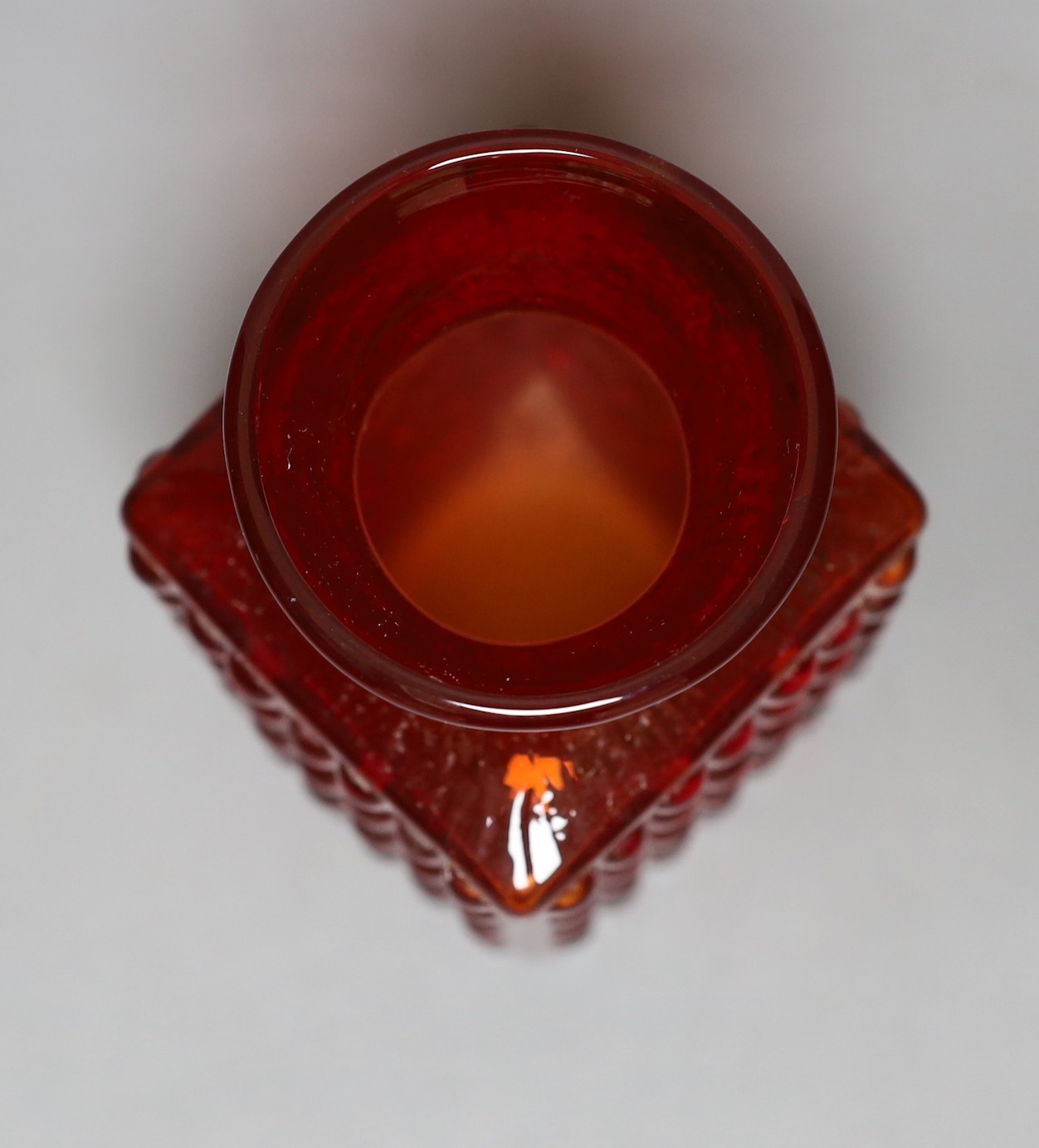 A Whitefriars 'Chess' glass vase, designed by Geoffrey Baxter, pattern number 9817, red glass, 14.5cm tall